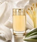 Imagen ambientada del perfume Baiser Vole De Cartier 100 ML Mujer EDP con notas de Pétalos De Lirio, Pistilo De Lirio, Hoja D... - VALMARA